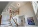 Bright foyer with soaring ceilings, a staircase, and an elegant chandelier at 13244 Snow Owl Dr, Carmel, IN 46033
