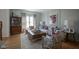 Well-appointed living room with chic decor, wood floors and natural light at 13244 Snow Owl Dr, Carmel, IN 46033