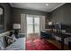 Bright home office featuring a sofa, workspace, and large window with natural light at 13244 Snow Owl Dr, Carmel, IN 46033