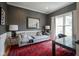 Inviting home office with a sofa, area rug, and stylish decor creating a professional workspace at 13244 Snow Owl Dr, Carmel, IN 46033