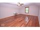 Spacious bedroom with beautiful hardwood floors, ceiling fan, and lots of natural light at 1340 Apache Trl, Martinsville, IN 46151