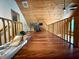 Spacious bonus room with hardwood floors and a wood paneled ceiling at 1340 Apache Trl, Martinsville, IN 46151