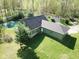 Aerial view of the home with a pond in the backyard and long driveway at 1340 Apache Trl, Martinsville, IN 46151