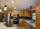 Well-equipped kitchen featuring stainless steel appliances, granite countertops, and ample storage space at 1340 Apache Trl, Martinsville, IN 46151