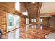 Open concept living space featuring vaulted ceilings and multiple windows at 1340 Apache Trl, Martinsville, IN 46151