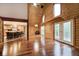 Spacious living room showcasing vaulted ceilings, wood walls, and sleek wood flooring at 1340 Apache Trl, Martinsville, IN 46151