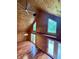 The living room features wood paneling, hardwood floors, high ceilings, and double doors leading to the outside at 1340 Apache Trl, Martinsville, IN 46151