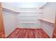 Walk-in closet with hardwood floors and installed shelving at 1340 Apache Trl, Martinsville, IN 46151