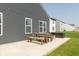 Outdoor patio with dining table and benches, ideal for entertaining in the spacious backyard at 1483 Paper Birch Dr, Sheridan, IN 46069