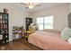 Well-lit bedroom with a ceiling fan and a comfortable bed with storage units at 1483 Paper Birch Dr, Sheridan, IN 46069