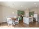 Eat-in kitchen with a dining nook and modern green cabinets at 1483 Paper Birch Dr, Sheridan, IN 46069