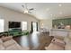 Open-concept living room with hardwood floors connecting to dining area and kitchen, great for entertaining at 1483 Paper Birch Dr, Sheridan, IN 46069