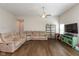 Comfortable living room with a large sectional sofa, hardwood floors and a bright, airy feel at 1483 Paper Birch Dr, Sheridan, IN 46069