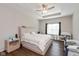 Serene primary bedroom with a tray ceiling, large window, and neutral decor at 1483 Paper Birch Dr, Sheridan, IN 46069
