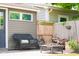 Backyard features a patio with wicker seating, a fire pit, and a wooden fence at 1730 Hoyt Ave, Indianapolis, IN 46203