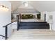 Multi-level loft space features cozy seating, natural light, and wood floors at 1730 Hoyt Ave, Indianapolis, IN 46203