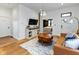 Bright and airy living room with hardwood floors, a modern TV setup, and a comfortable seating area at 1730 Hoyt Ave, Indianapolis, IN 46203