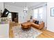 Warm and inviting living room with hardwood floors, a comfortable couch, and bright windows at 1730 Hoyt Ave, Indianapolis, IN 46203
