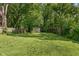 Spacious backyard with a large, well-maintained lawn and a storage shed at 1802 E 66Th St, Indianapolis, IN 46220