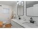 Modern bathroom features double sinks, updated fixtures, and stylish mirrors for a spa-like experience at 1802 E 66Th St, Indianapolis, IN 46220