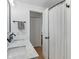 Bright bathroom featuring a double sink with marble countertop and sleek black fixtures at 1802 E 66Th St, Indianapolis, IN 46220