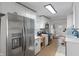 Bright kitchen with stainless steel appliances and white cabinetry provides a modern cooking space at 1802 E 66Th St, Indianapolis, IN 46220