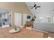 Open concept living area with vaulted ceilings connects dining and kitchen in a cohesive design at 1802 E 66Th St, Indianapolis, IN 46220
