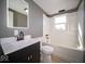 Modern bathroom with sleek vanity, tub-shower combo, and bright window providing natural light at 1808 Raible Ave, Anderson, IN 46011