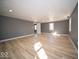 Large open bedroom area with recessed lighting and multiple windows at 1808 Raible Ave, Anderson, IN 46011