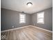 Bright bedroom features two windows, light-colored walls, and modern flooring at 1808 Raible Ave, Anderson, IN 46011