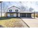 Charming two-story home with a spacious driveway and an attached two car garage at 1808 Raible Ave, Anderson, IN 46011
