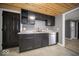 This is a beautiful kitchen with updated countertops, grey cabinets and wooden ceiling at 1808 Raible Ave, Anderson, IN 46011