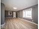 Bright living room with hardwood floors, gray walls, and natural light at 1808 Raible Ave, Anderson, IN 46011