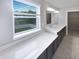 Primary bathroom featuring a double sink vanity with a large window to outside at 18230 Sandy Cove Ln, Westfield, IN 46074