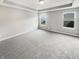 Spacious primary bedroom with neutral walls, tray ceiling, and carpet flooring at 18230 Sandy Cove Ln, Westfield, IN 46074