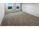 Neutral bedroom featuring carpeted floors and a pair of windows at 18230 Sandy Cove Ln, Westfield, IN 46074