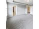 Large primary bedroom showcasing carpet, tray ceiling, and ensuite entrance at 18230 Sandy Cove Ln, Westfield, IN 46074