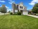 Charming two-story home with a well-manicured lawn and a two-car garage at 18230 Sandy Cove Ln, Westfield, IN 46074