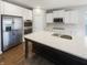 Bright kitchen featuring stainless steel appliances, white cabinets, and an island with a sink at 18230 Sandy Cove Ln, Westfield, IN 46074