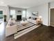 Bright living room with a fireplace, modern furniture, and a striped rug at 18230 Sandy Cove Ln, Westfield, IN 46074