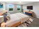 Bright main bedroom featuring large windows, a ceiling fan, and stylish furnishings at 18230 Sandy Cove Ln, Westfield, IN 46074