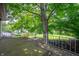 Balcony overlooking a lush green backyard, ideal for enjoying the outdoors at 2120 Wynnedale Rd, Indianapolis, IN 46228