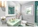 Unique bathroom with vintage-style green sink, custom mirror and mosaic green tiled floor at 2120 Wynnedale Rd, Indianapolis, IN 46228