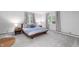 Minimalist bedroom with a large bed, neutral colors, and natural light at 2120 Wynnedale Rd, Indianapolis, IN 46228