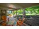 Covered patio with outdoor seating, perfect for relaxing and enjoying the serene backyard at 2120 Wynnedale Rd, Indianapolis, IN 46228