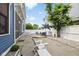 Inviting backyard featuring a patio with seating, a small garden, and a charming white fence at 2191 Greencroft St, Carmel, IN 46032