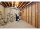 Unfinished basement with exposed pipes and plywood at 2191 Greencroft St, Carmel, IN 46032