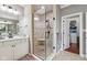 Bathroom with a walk-in shower, neutral paint, and a white vanity with mirror at 2191 Greencroft St, Carmel, IN 46032