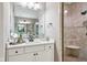 Bathroom with a walk-in shower, neutral paint, and a white vanity at 2191 Greencroft St, Carmel, IN 46032