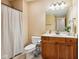 Standard bathroom with a single sink vanity, a toilet, a shower with a curtain, and neutral walls at 2191 Greencroft St, Carmel, IN 46032